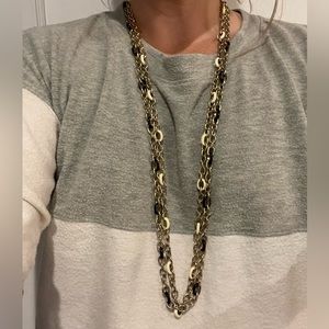 Gold chain with black/white enamel chain links.